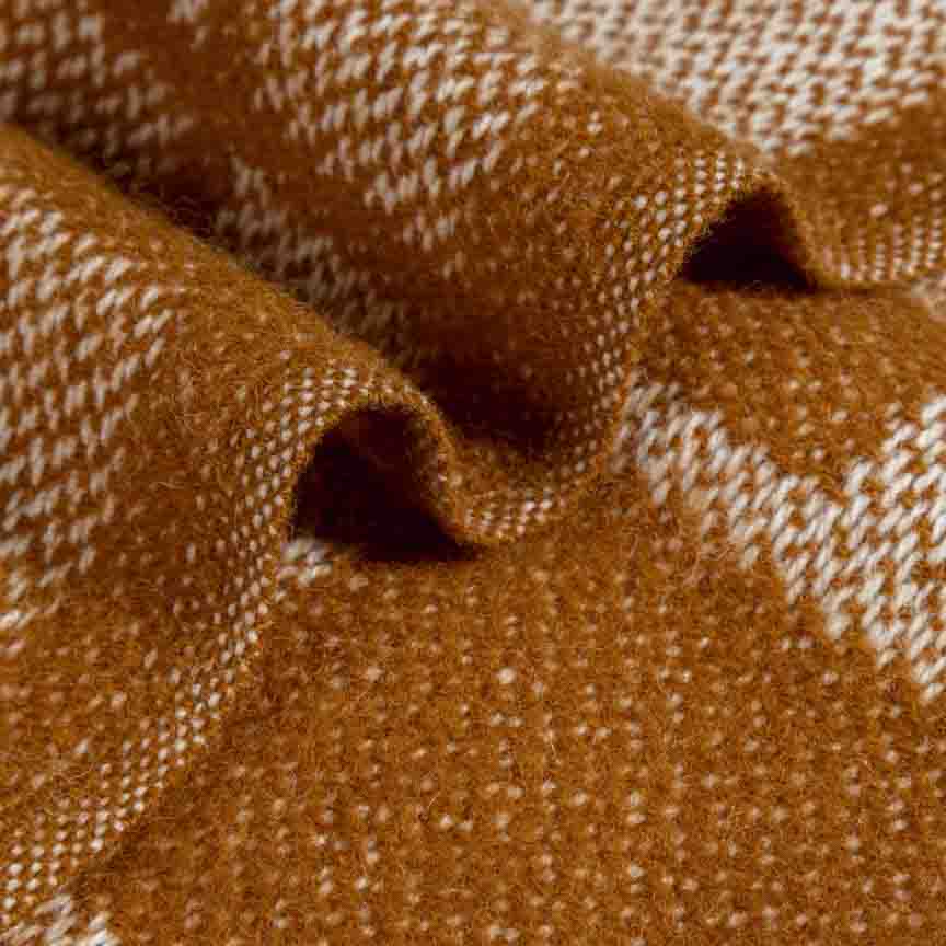 Close-up of brown blanket with a subtle pattern