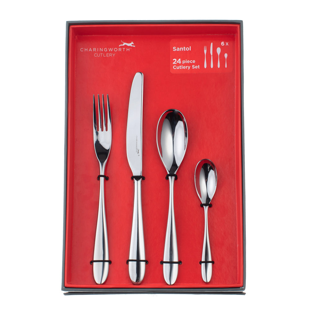 A set of silver flatware including a table knife, table fork, dessert spoon, and English teaspoon with curved handles, presented on a white background.