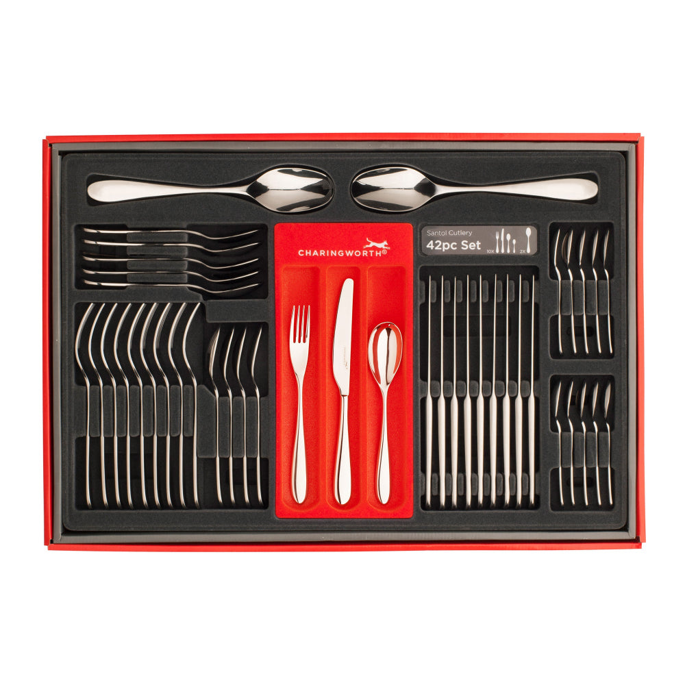 A set of silver flatware including a table knife, table fork, dessert spoon, and English teaspoon with curved handles, presented on a white background.