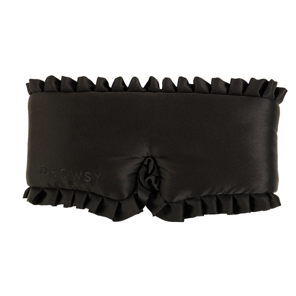 Black ruffled eye mask with 'Drowsy' branding on a white background