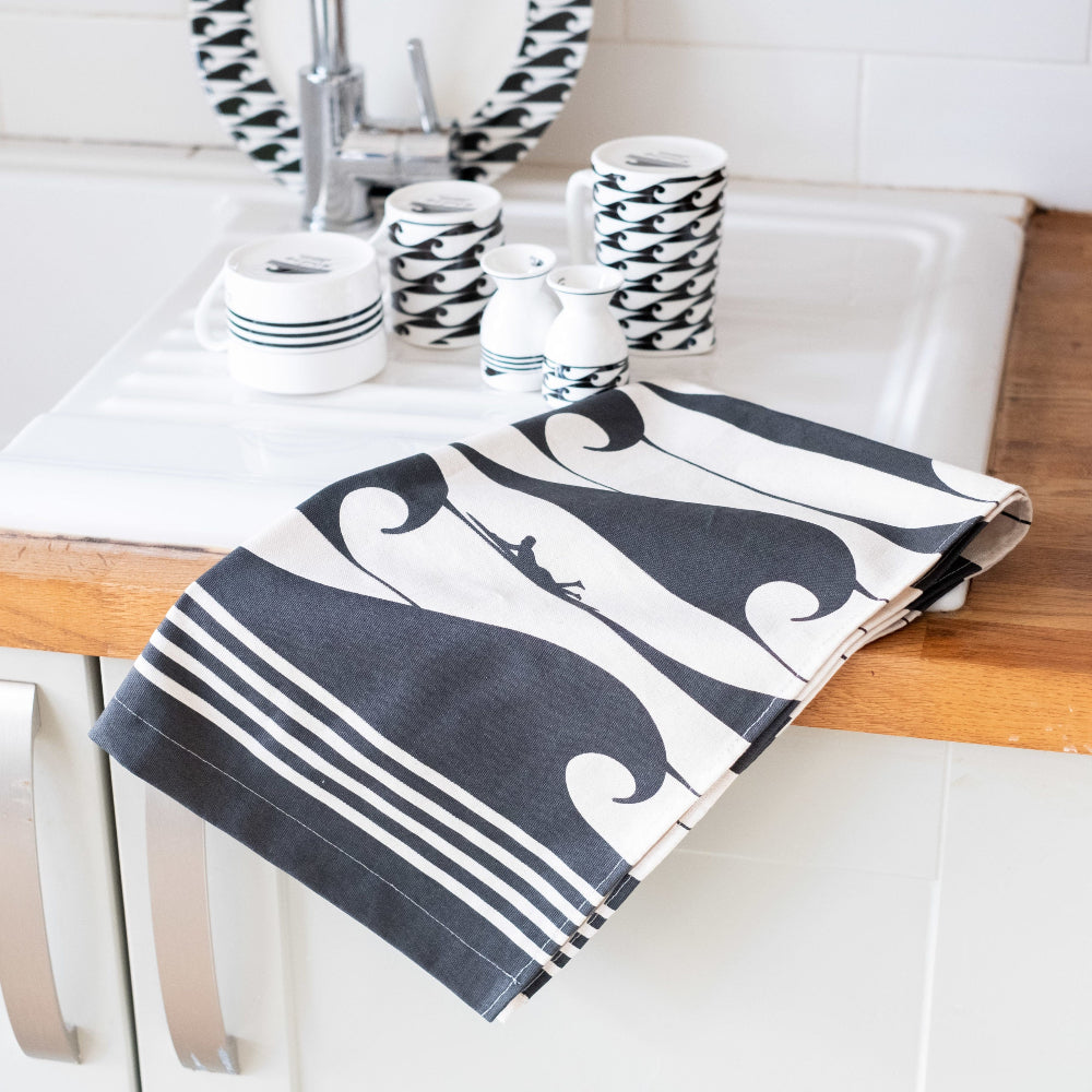 Kitchen towel with black and white pattern on a kitchen counter