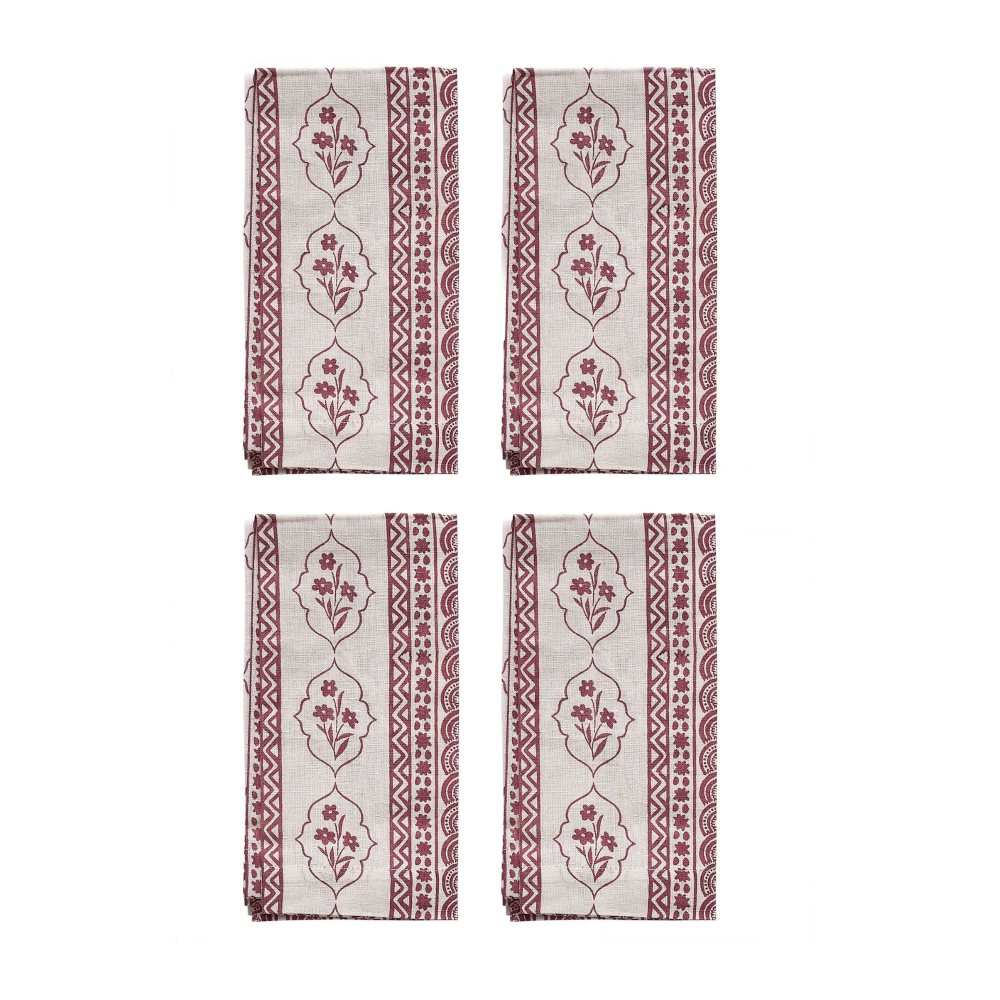 Four red and white patterned napkins on a white background
