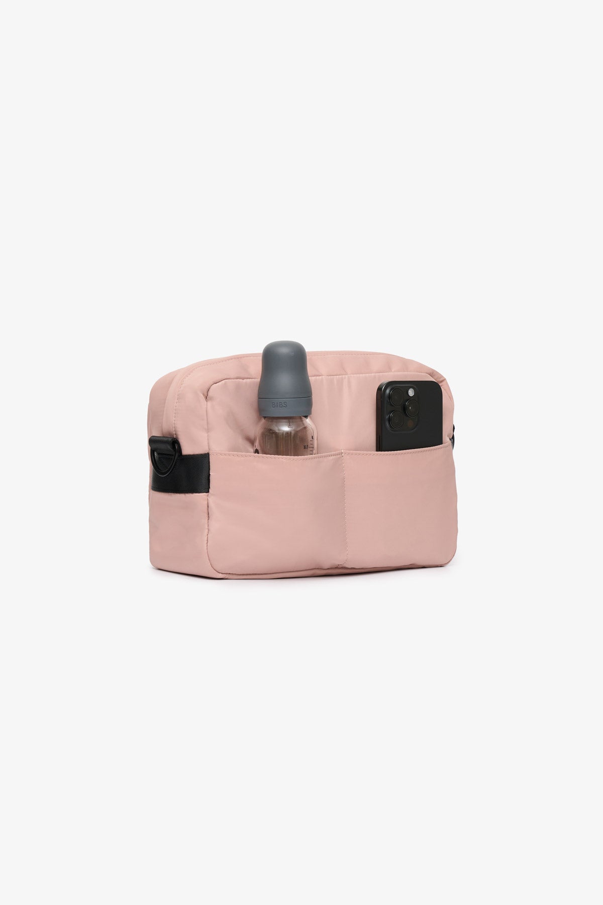 Pink pouch with black straps and a grey bottle on a white background