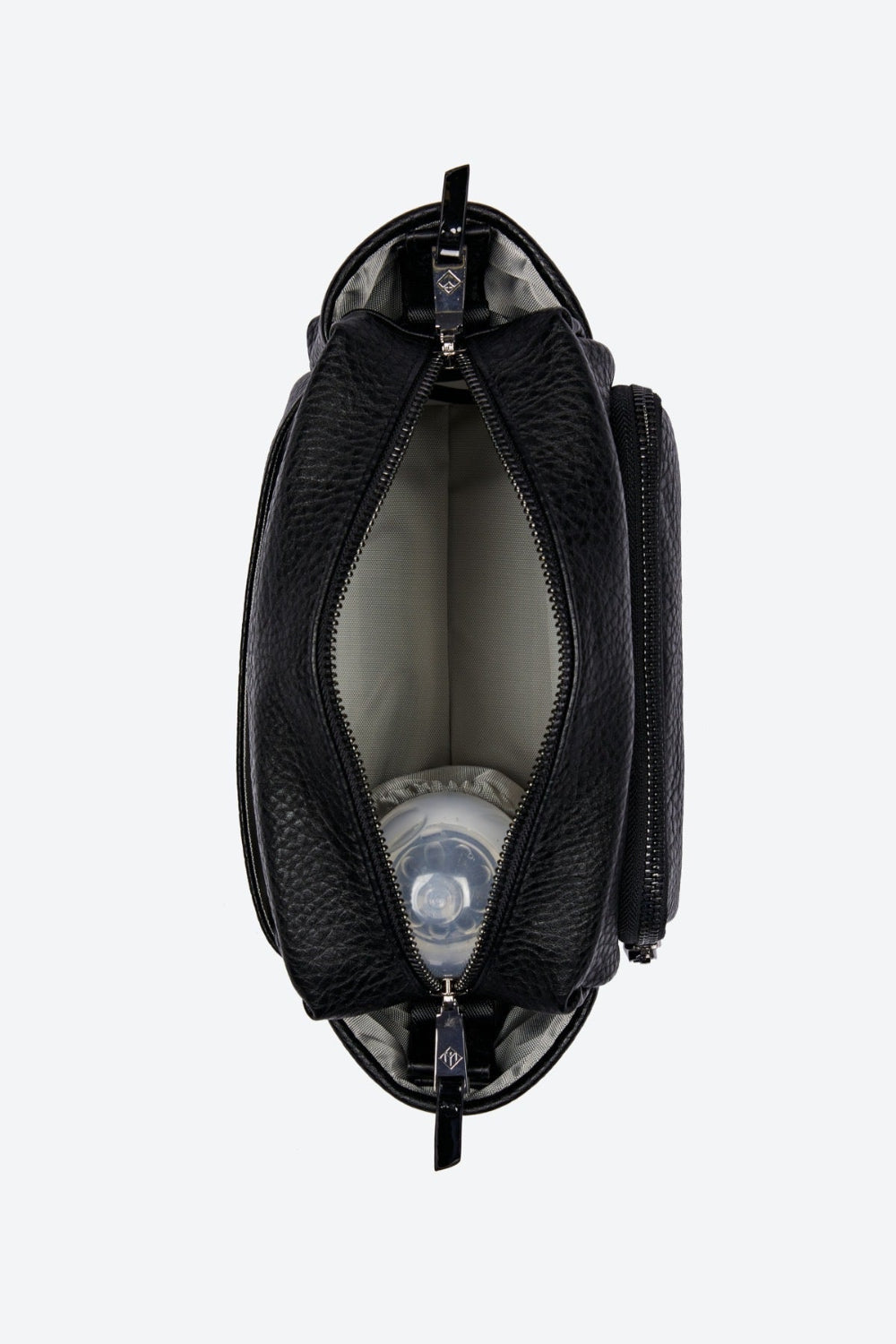 Black vegan leather crossbag with a white interior on a white background