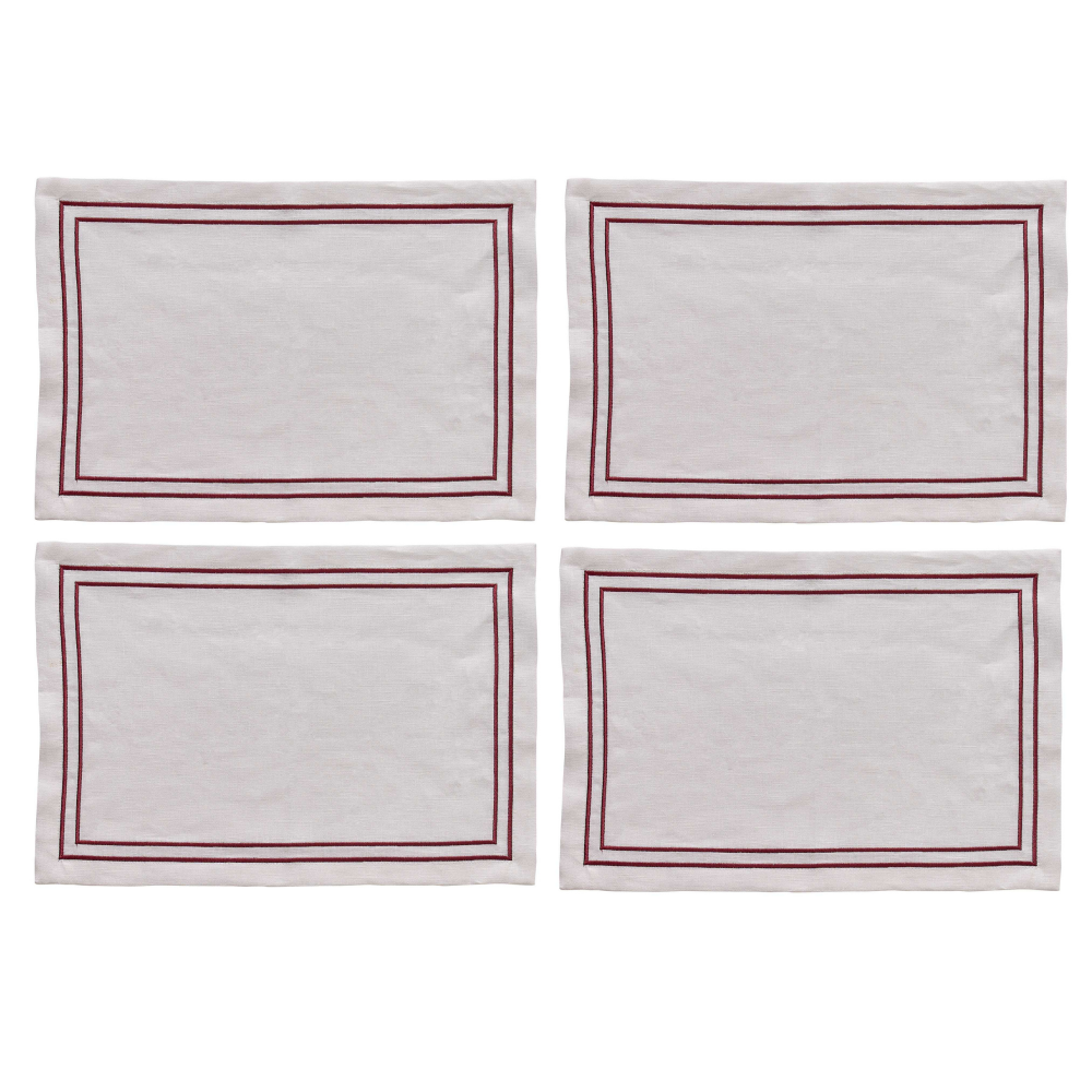 Four white placemats with red borders on a white background