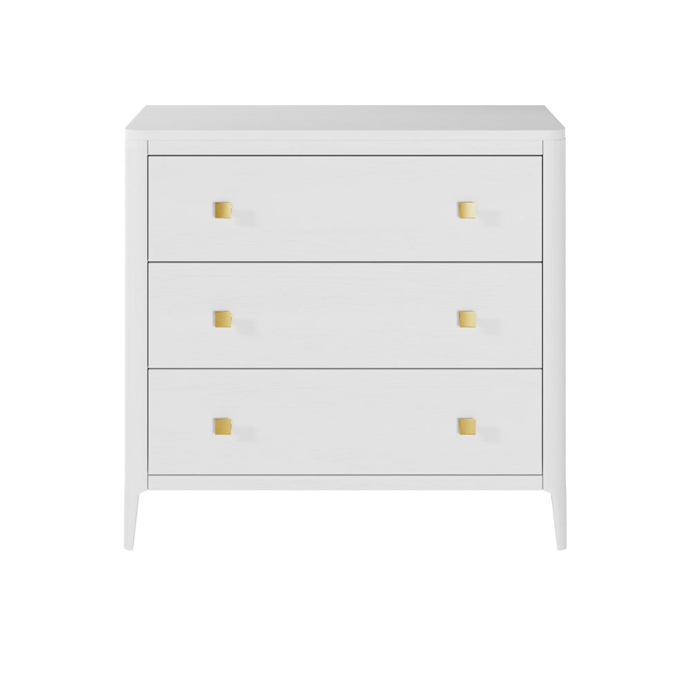 A white three-drawer chest of drawers with gold-coloured square handles and a sleek, curved front.