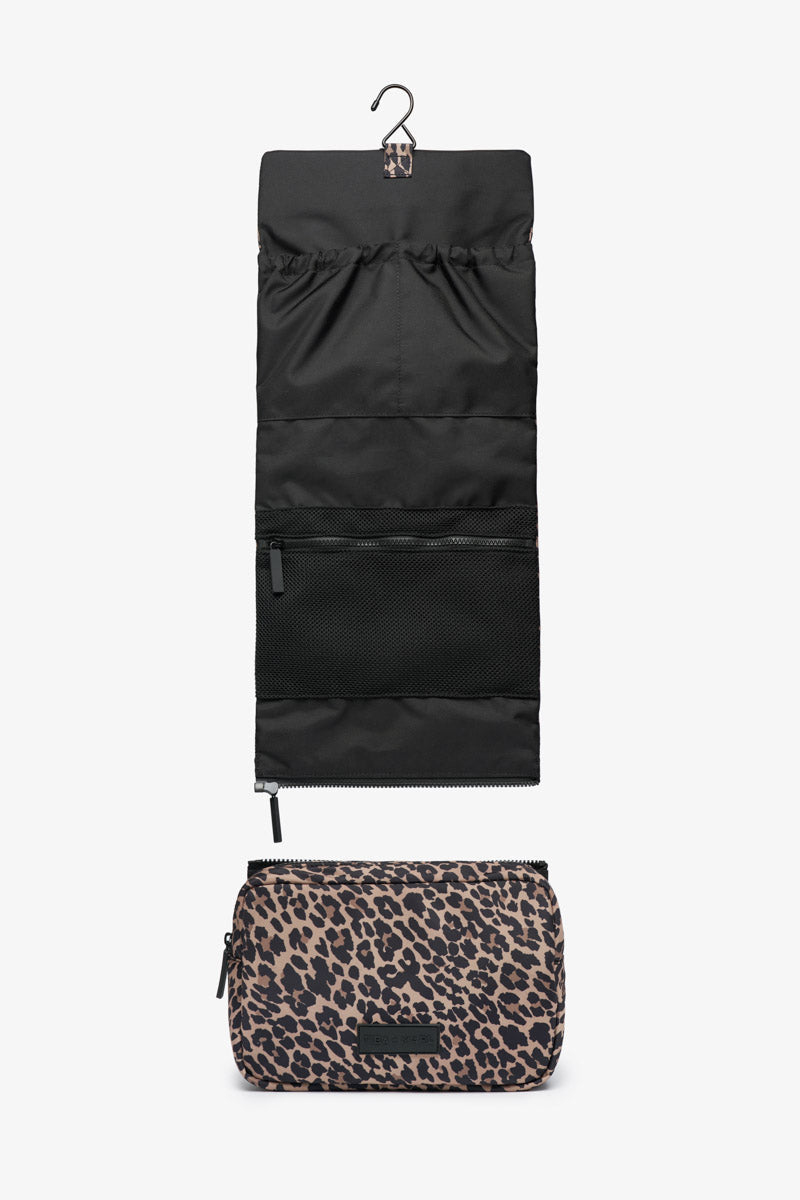 Black hanging washbag and leopard print pouch on a white background