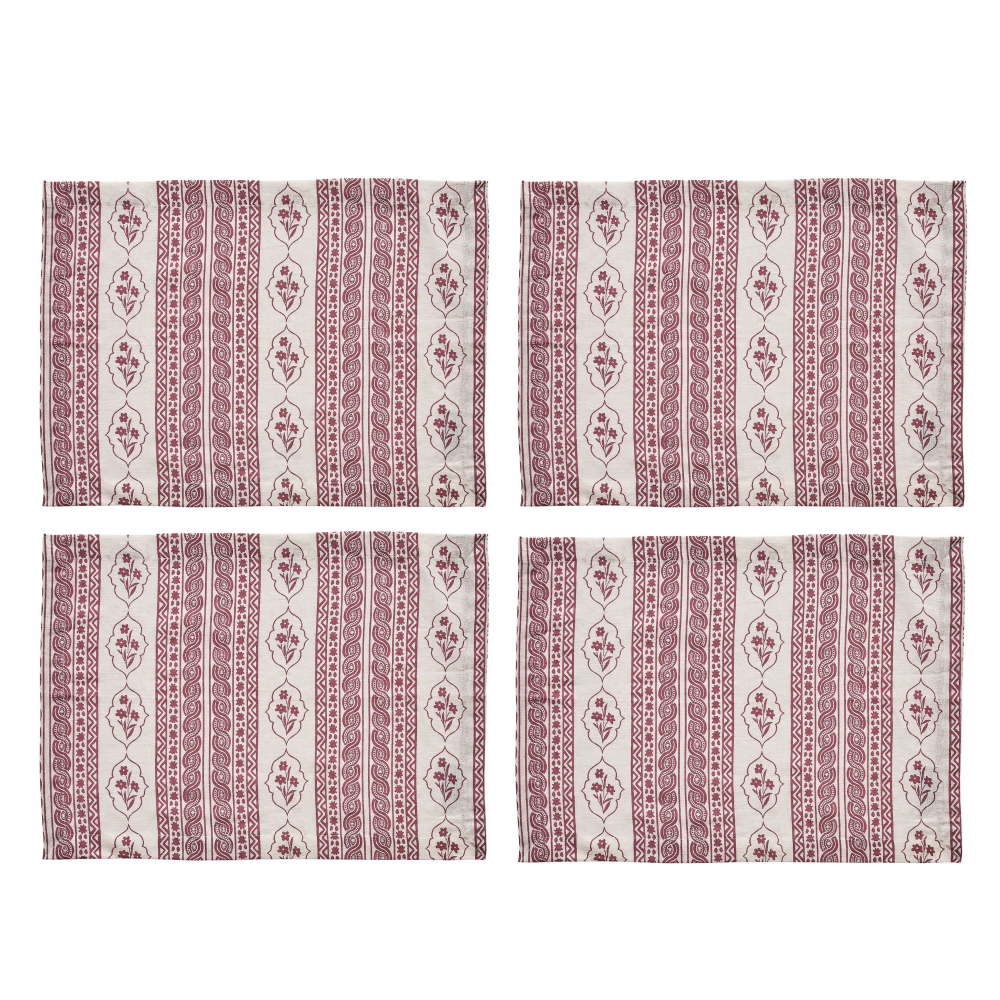 Set of four patterned placemats with a red and white design on a white background