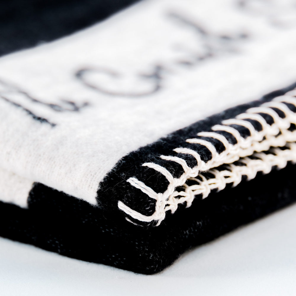 Close-up of The Cornish Surfer Black and white baby blanket