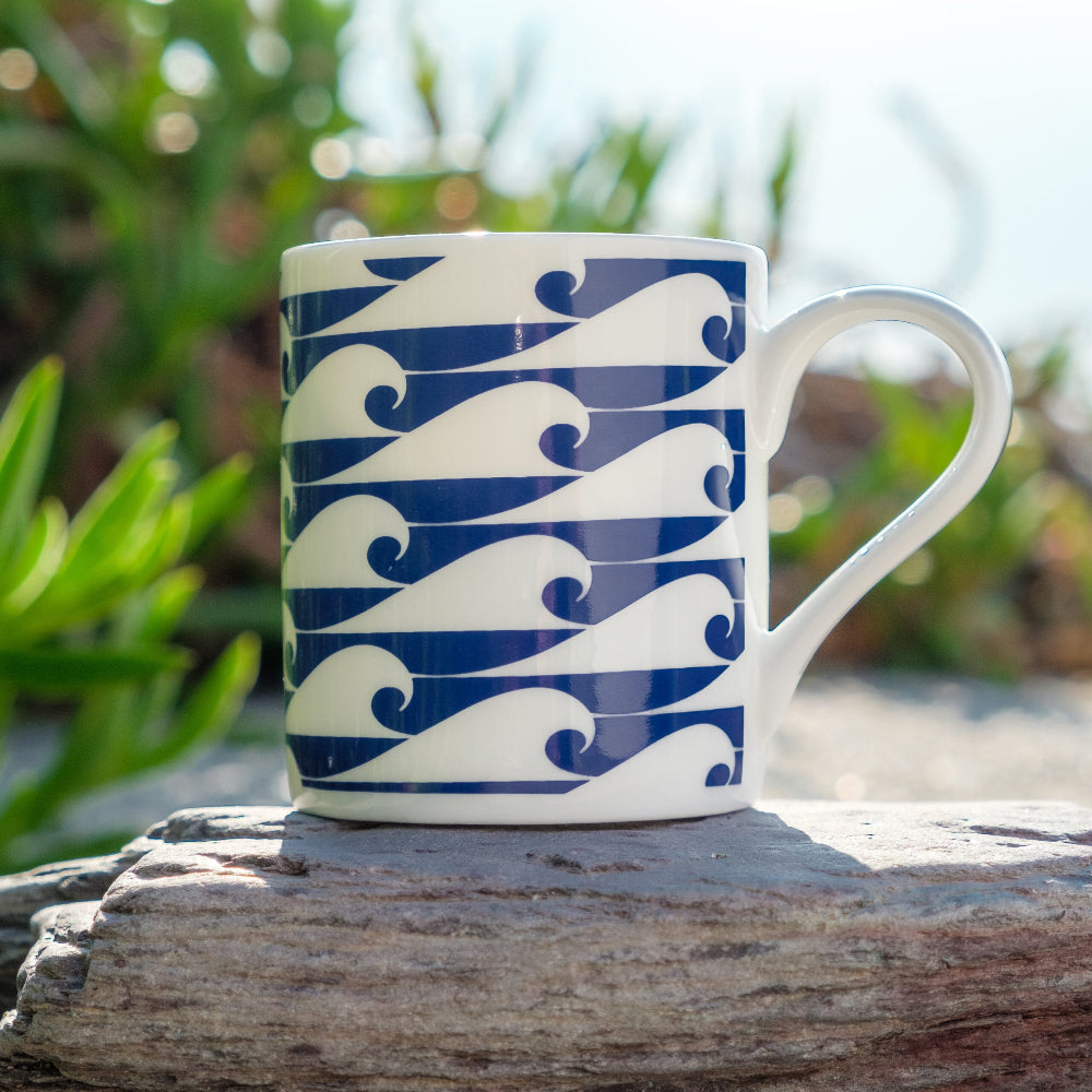 Espresso Cup with Blue wave pattern on a wooden surface with a natural background
