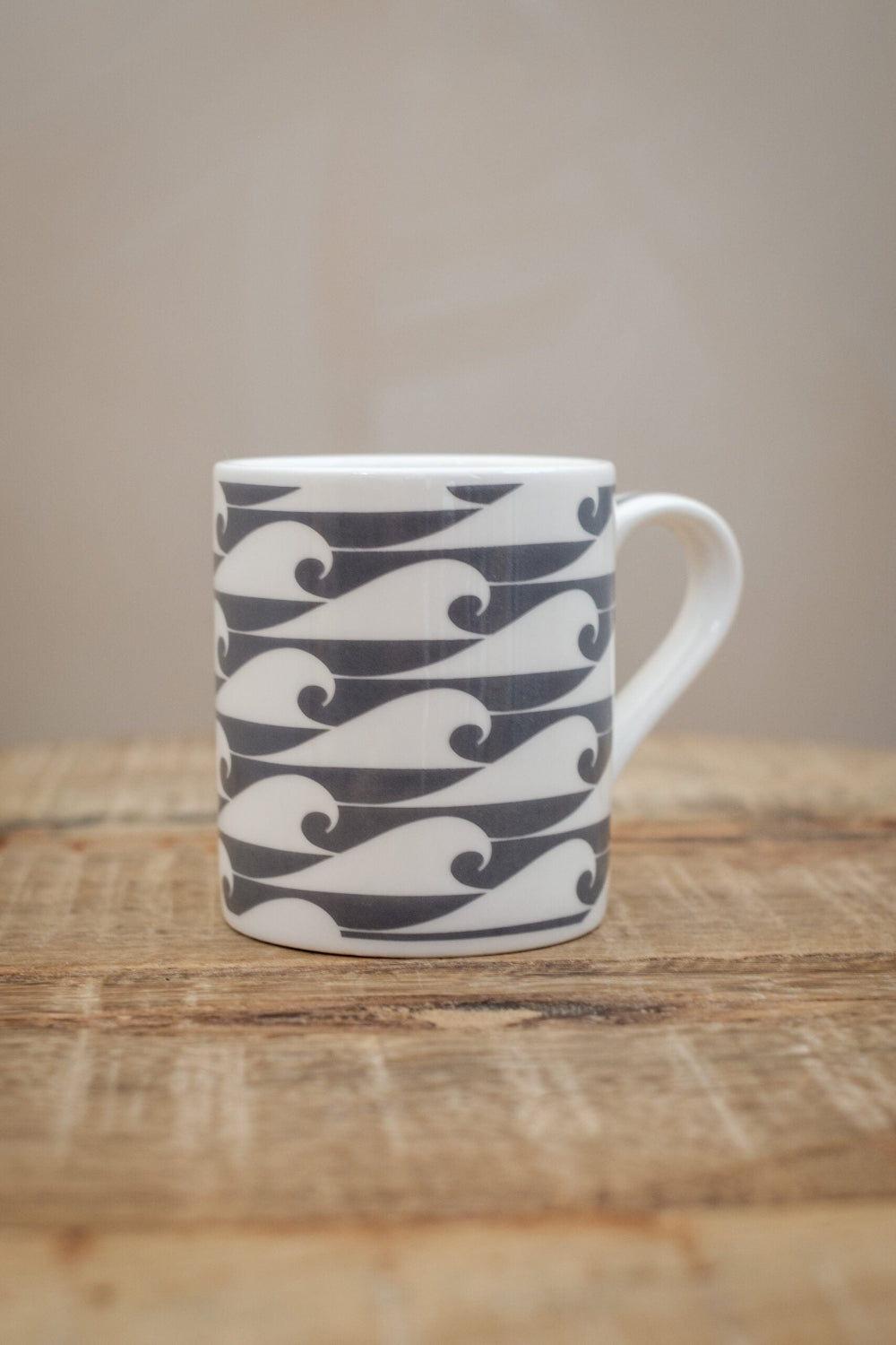 Espresso Mug with wave pattern on a wooden surface