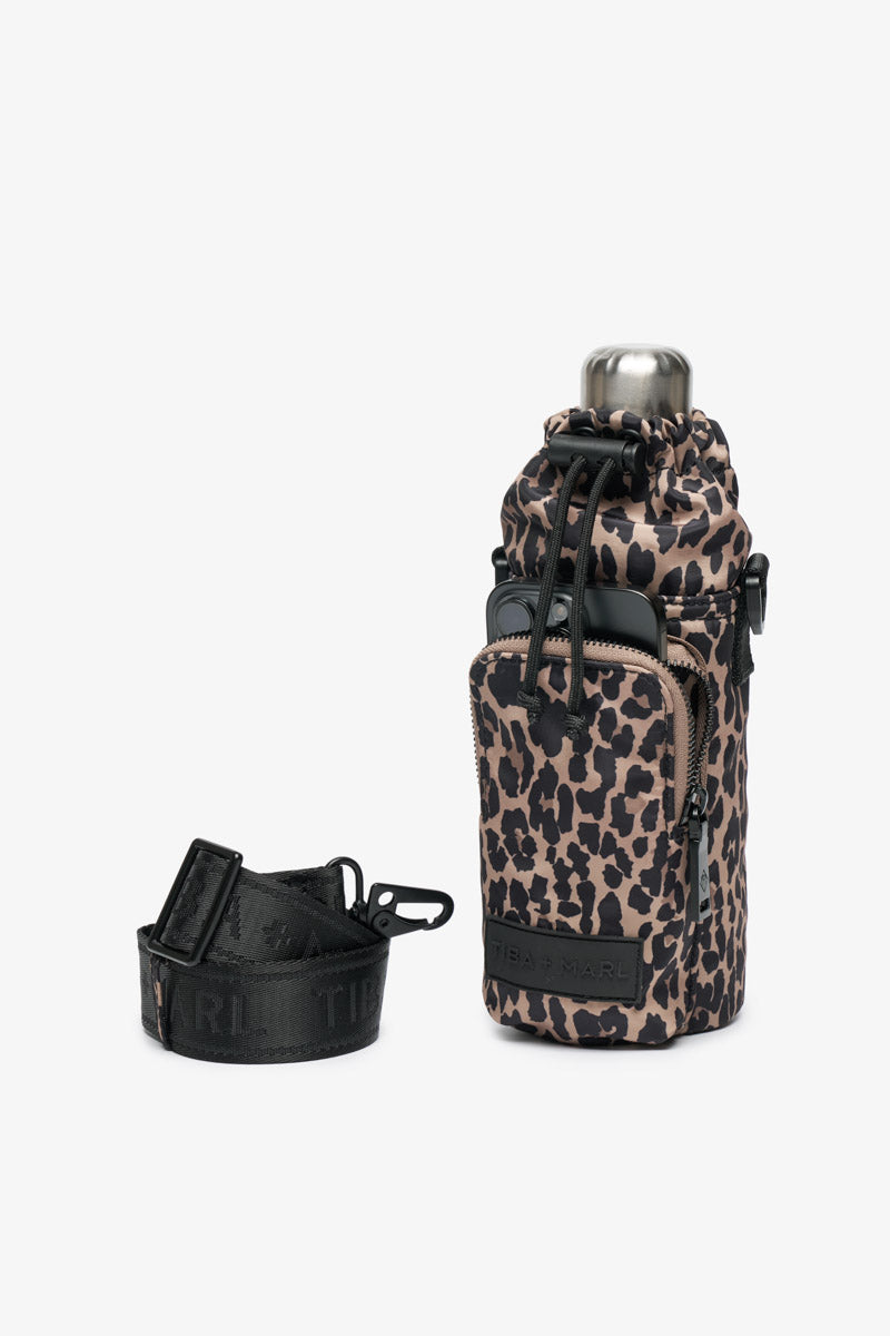 Leopard print water bottle holder with black strap on a white background