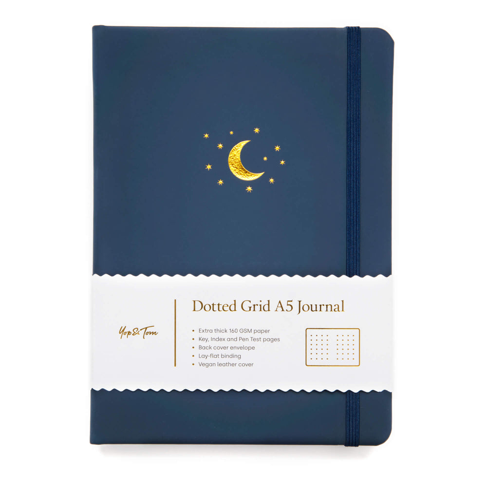 Yop & Tom Midnight blue dotted grid A5 journal with Gold moon and star design on a white background