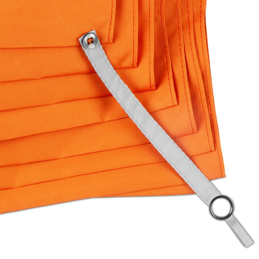 Metal straight edge on orange fabric background