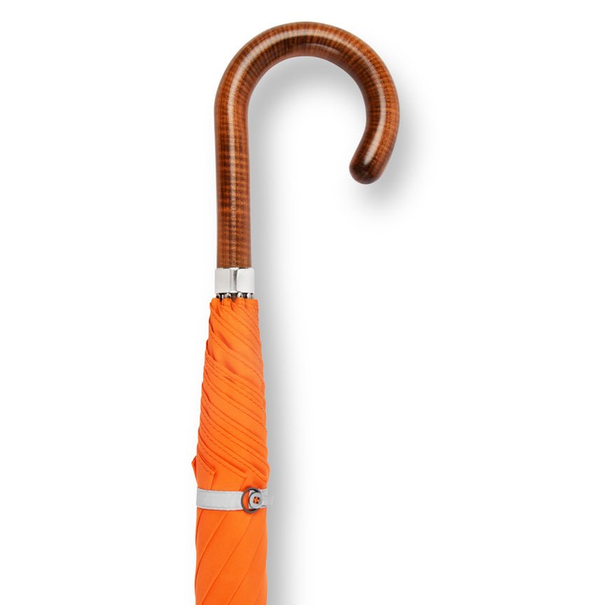 Orange umbrella with a wooden handle on a white background