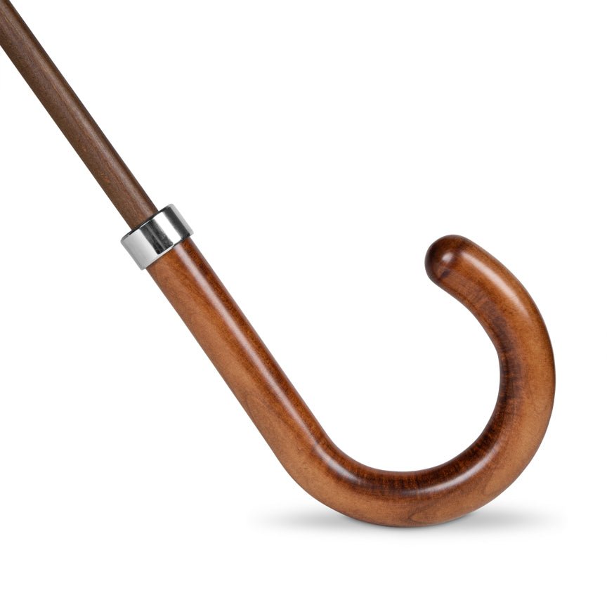 Wooden umbrella handle with a silver band on a white background
