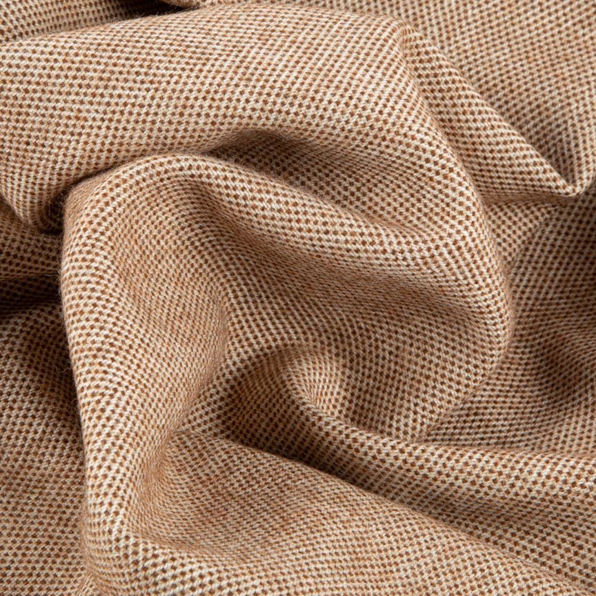 Close-up of textured brown blanket with a subtle pattern