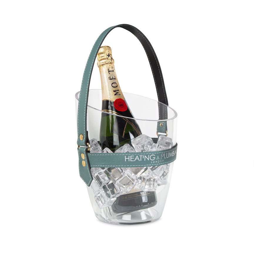 Clear ice bucket with a bottle of champagne and ice cubes on a white background