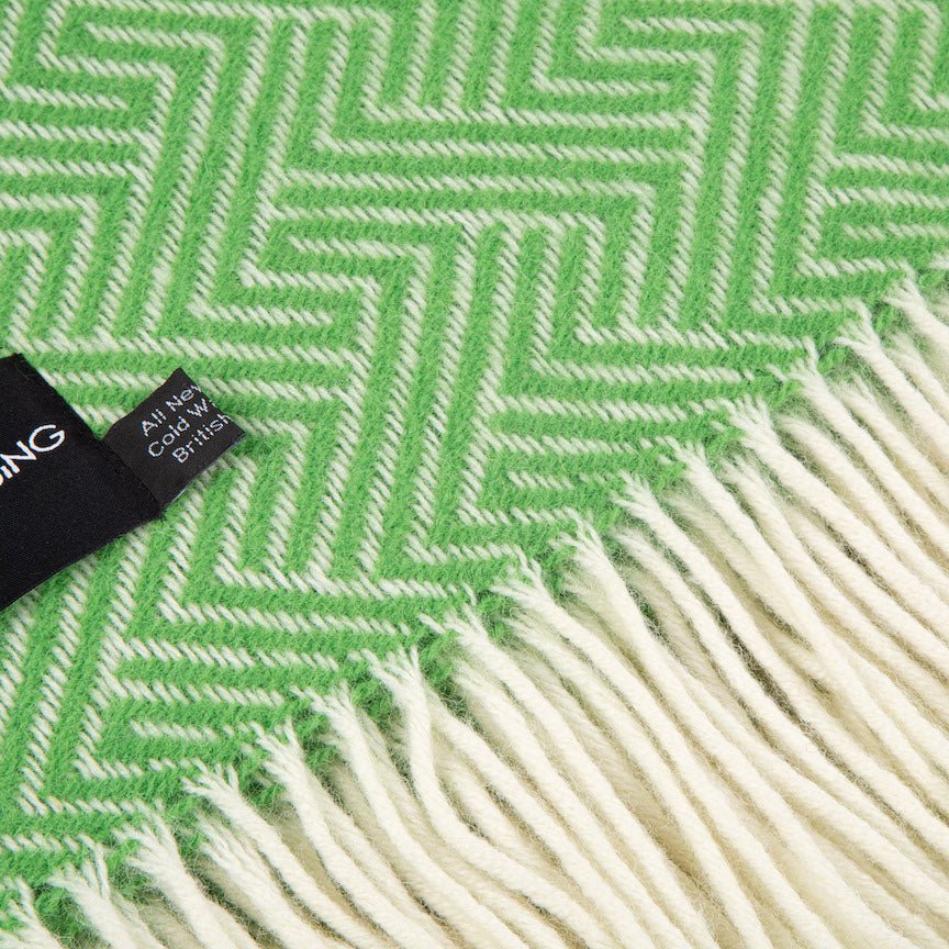 Green and white herringbone patterned fabric with a visible brand tag.
