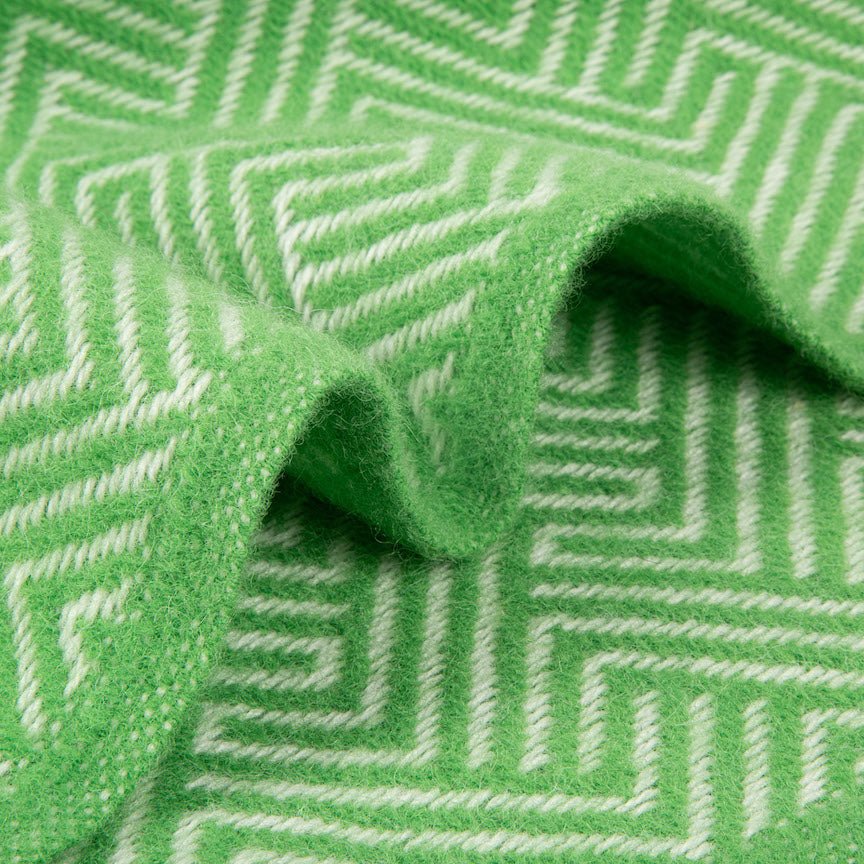 Close-up of green fabric with white geometric pattern