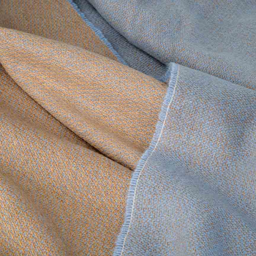 Close-up of beige and blue blanket