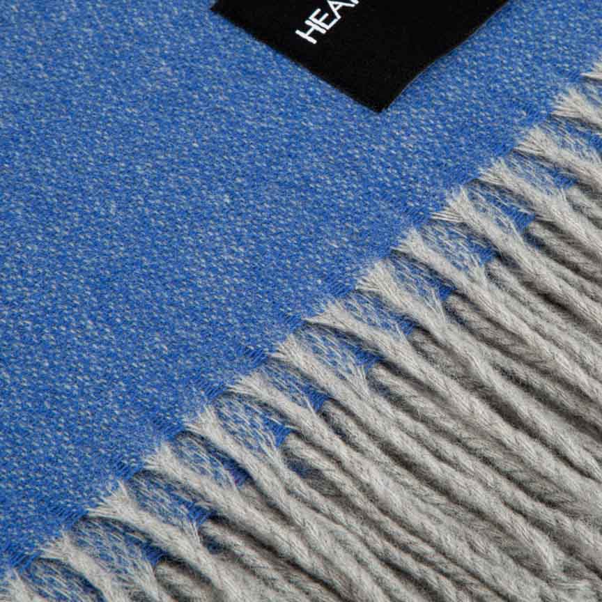 Blue and gray blanket with fringed edge