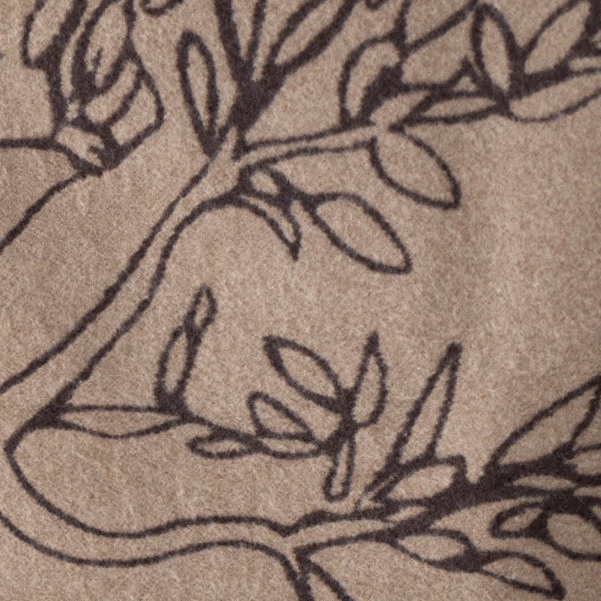 Close-up of a tree design on a blanket surface