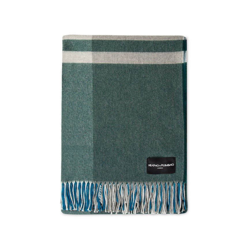 Plaid blanket with a brand label on a white background