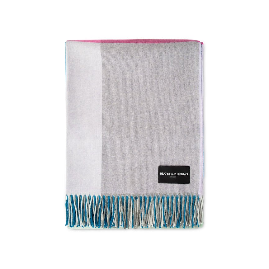 Grey and white scarf with blue fringe on a white background