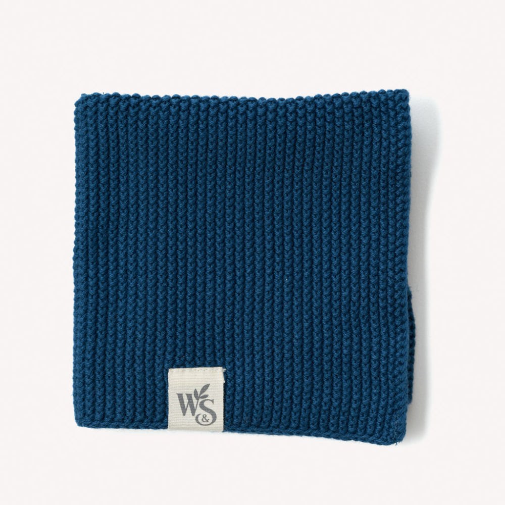 Ocean Blue knitted organic dishcloth with a logo on a white background