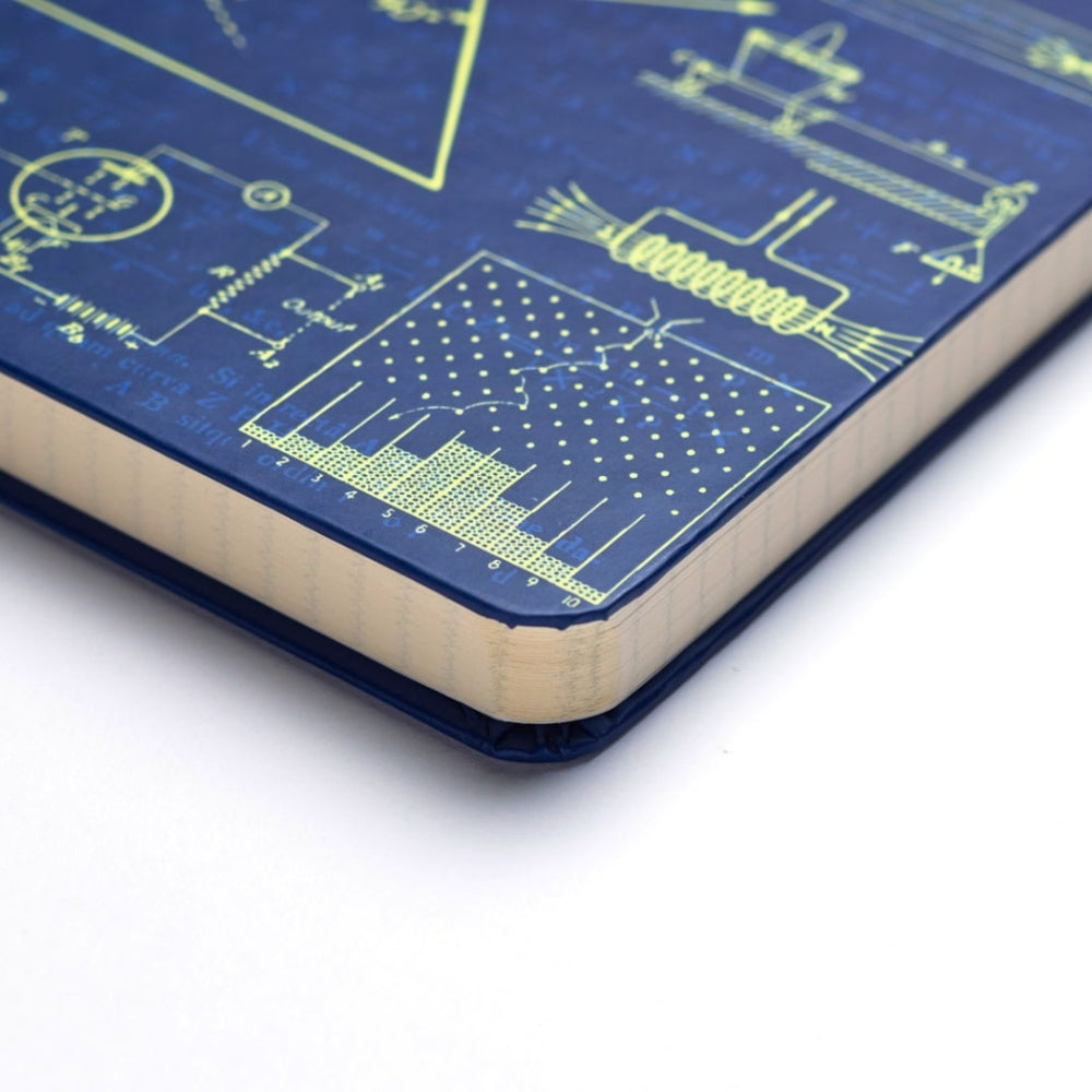 Close-up of a A5 Classical Physics notebook with technical drawings on a white background