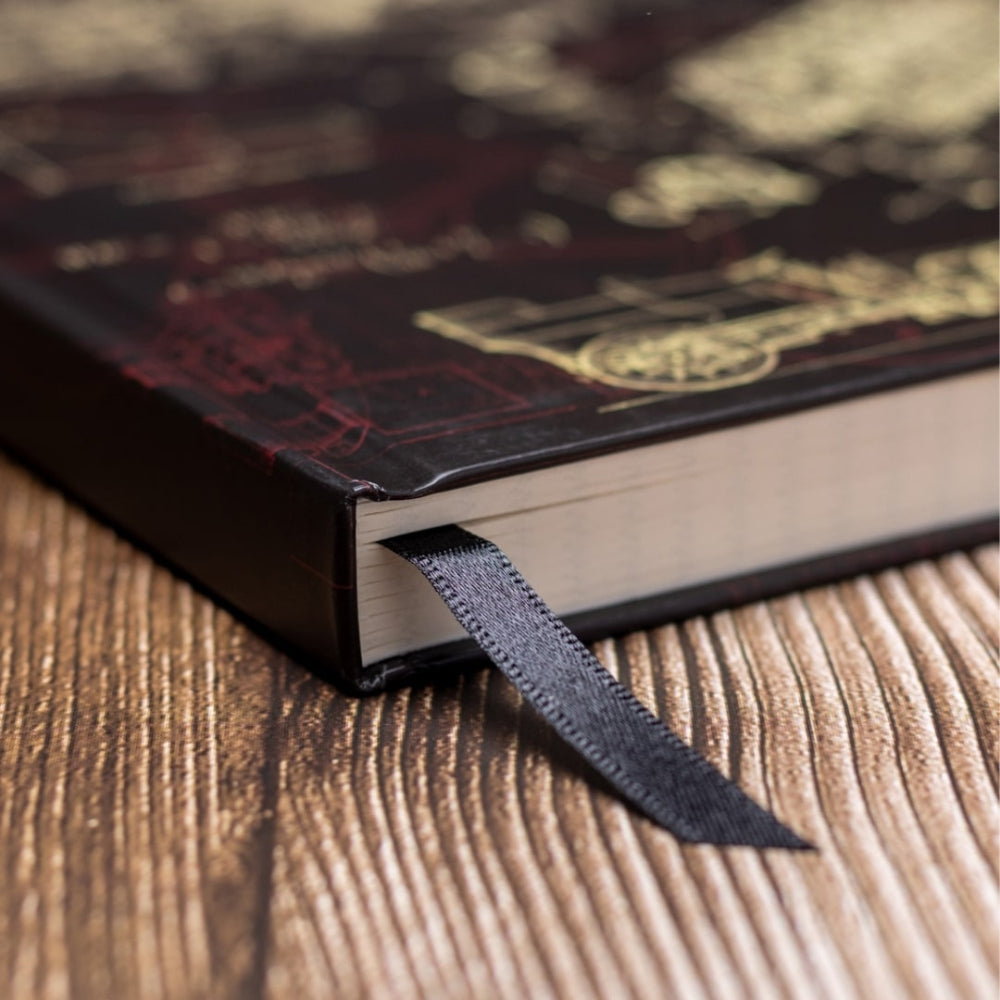 A5 Mechanical Engineering notebook with a ribbon marker on a wooden surface