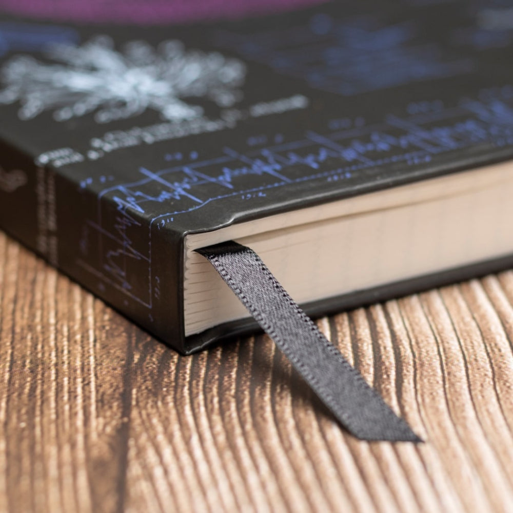A5 Microbiology NoteBook with a ribbon marker on a wooden surface