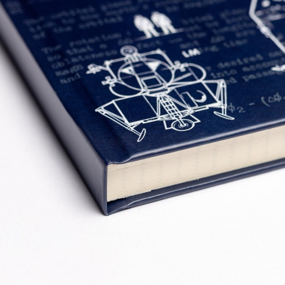 Blue book with white line drawing of a vehicle on a white background