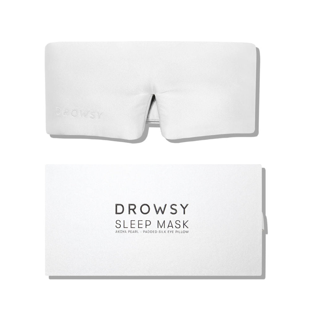 White sleep mask with matching white packaging on a white background
