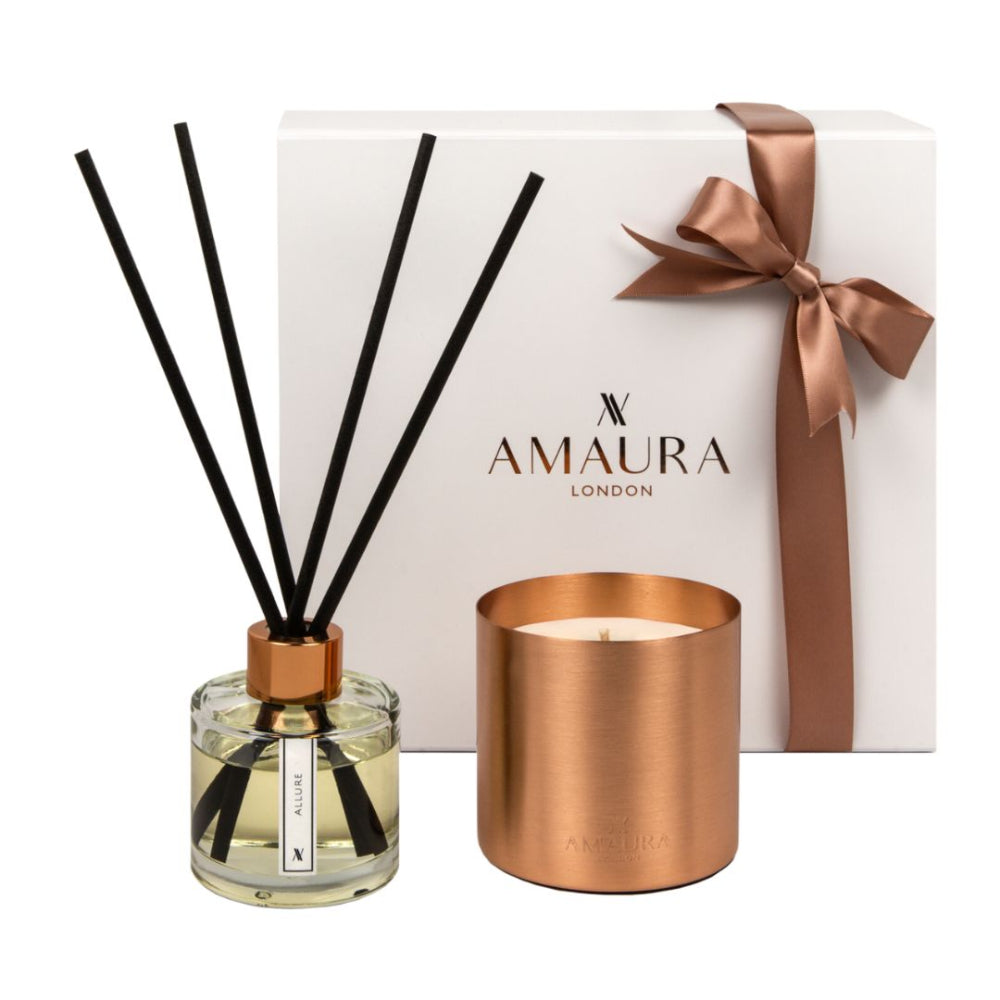 Amaura London candle and diffuser set with a white box featuring a brown ribbon on a white background.