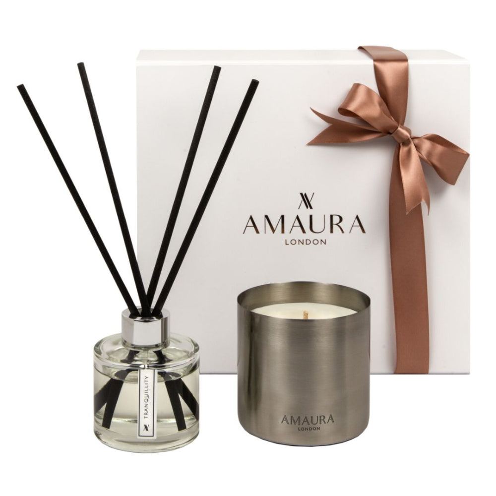 Amaura London candle and diffuser set with a white box featuring a brown ribbon on a white background.