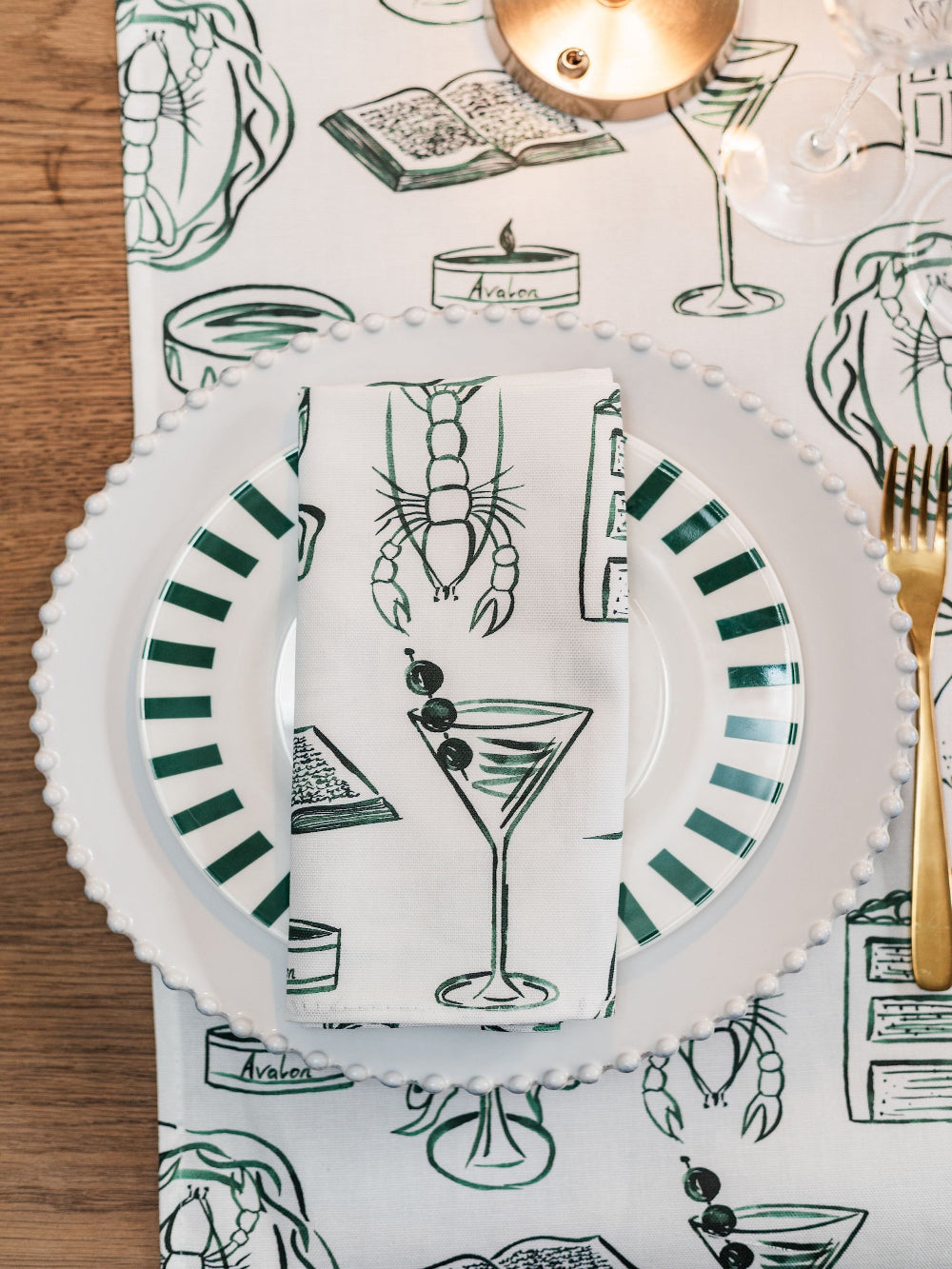 Placemat with cocktail-themed design on a wooden table