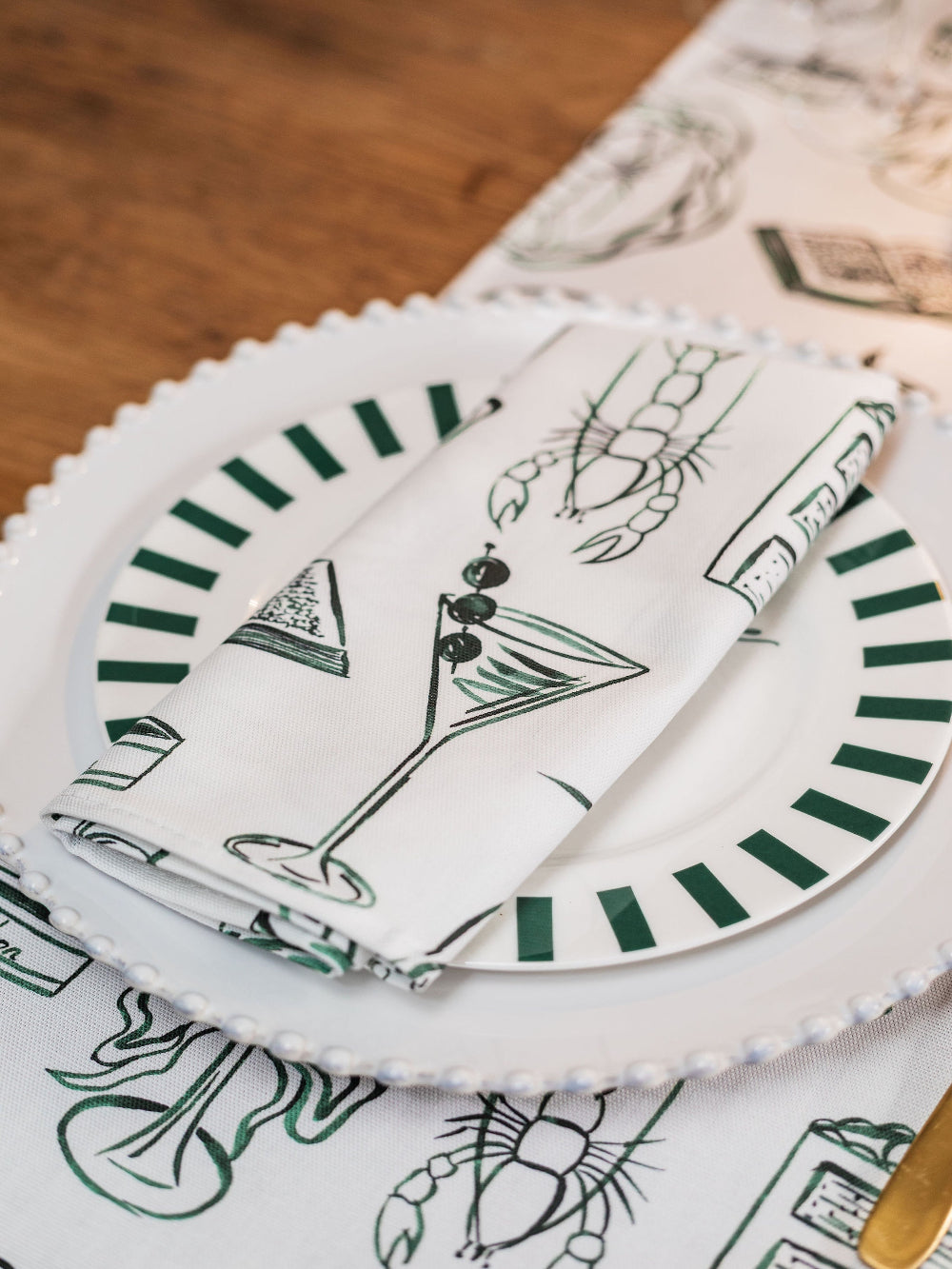 Napkins with green and white pattern on a table setting