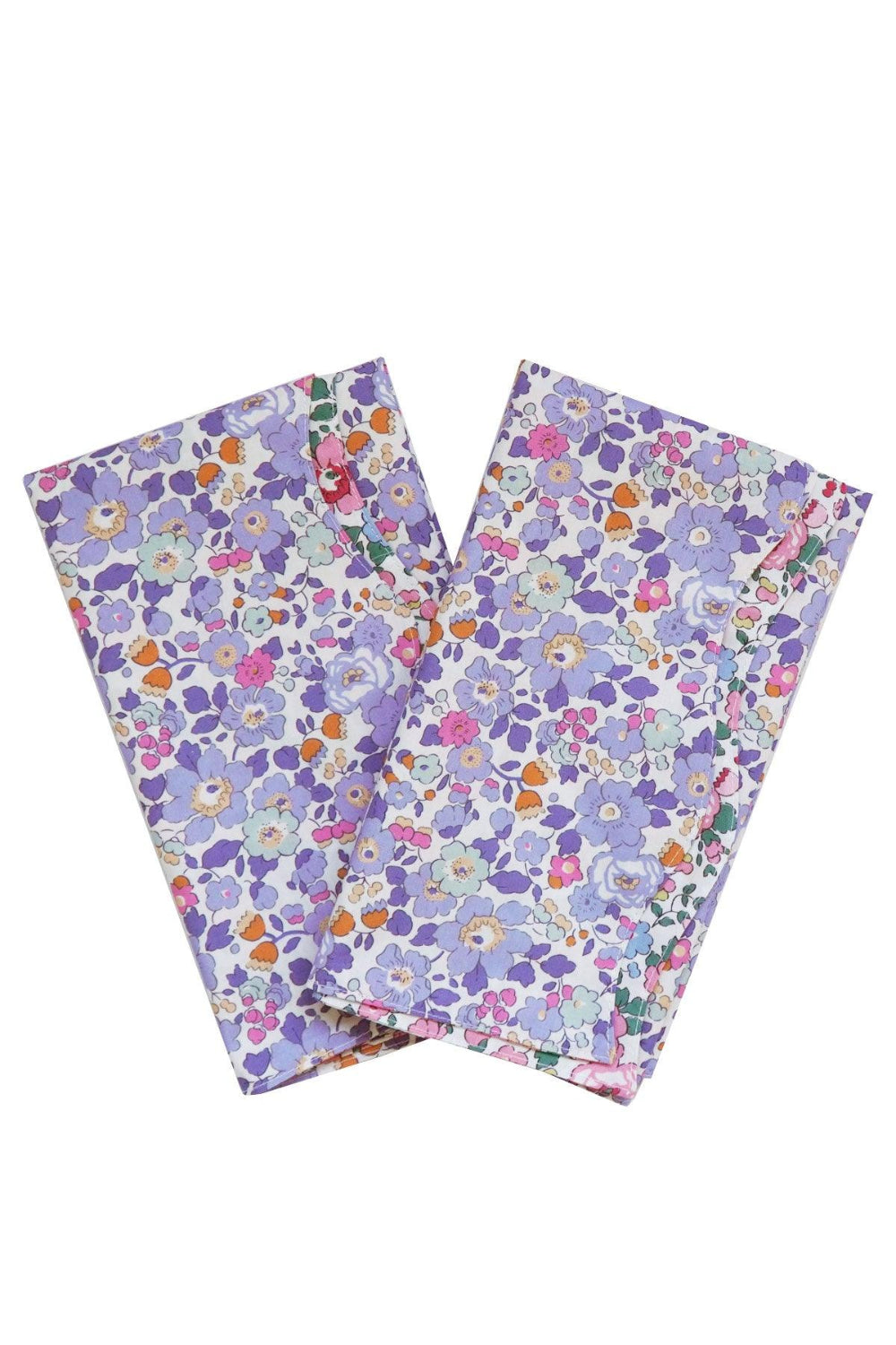 Two floral-patterned napkins Betsy Lavender Liberty pattern with a purple background on a white background