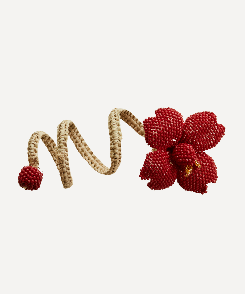 Red beaded Flower napkin ring on a white background
