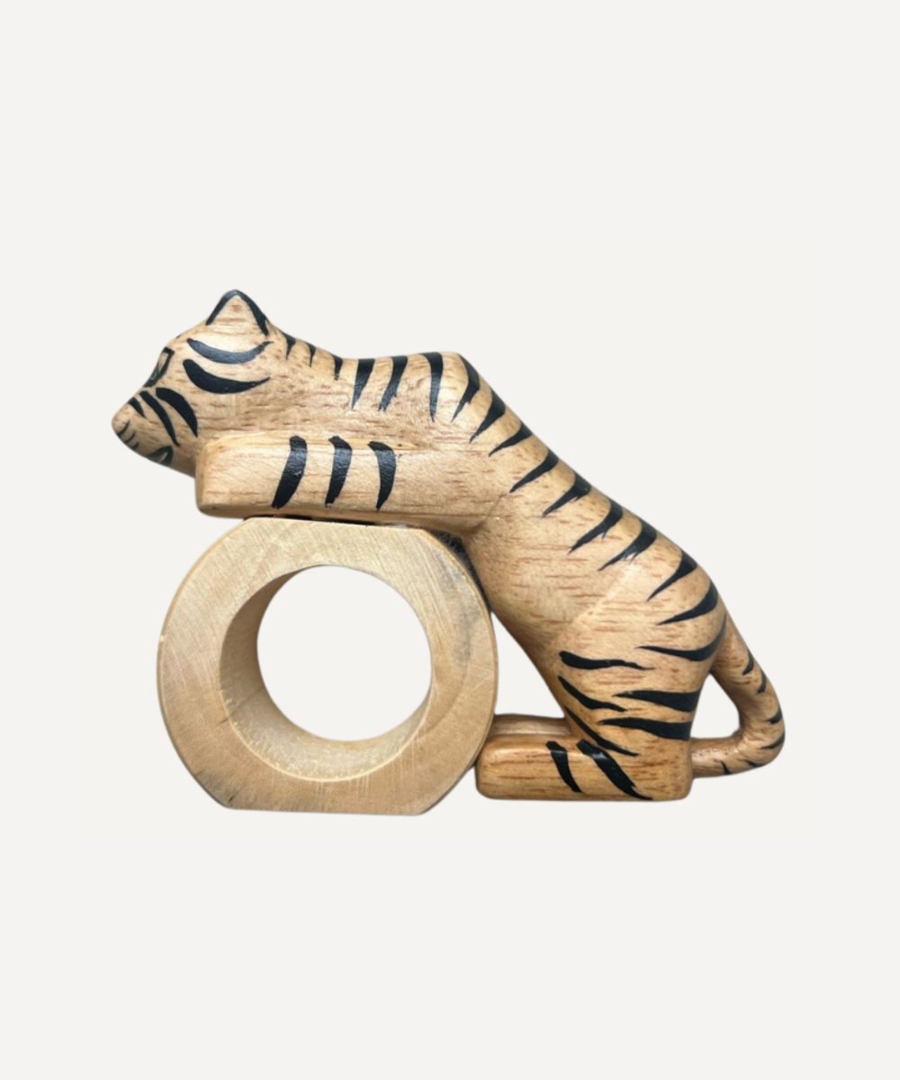 Wooden tiger-shaped napkin ring holder on a white background