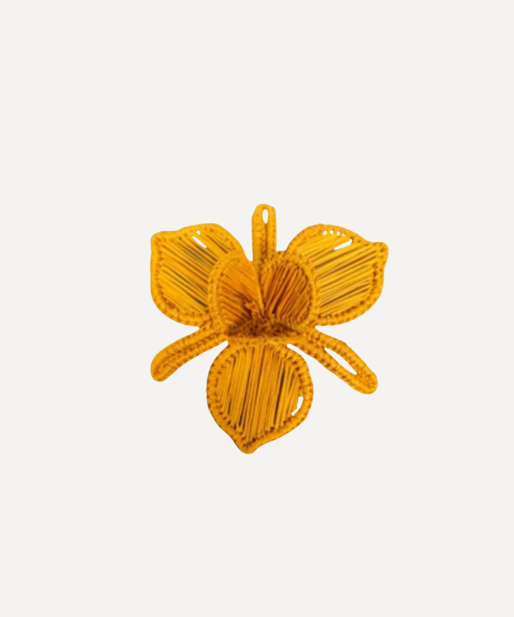 Yellow Orquídea flower napkin ring on a white background