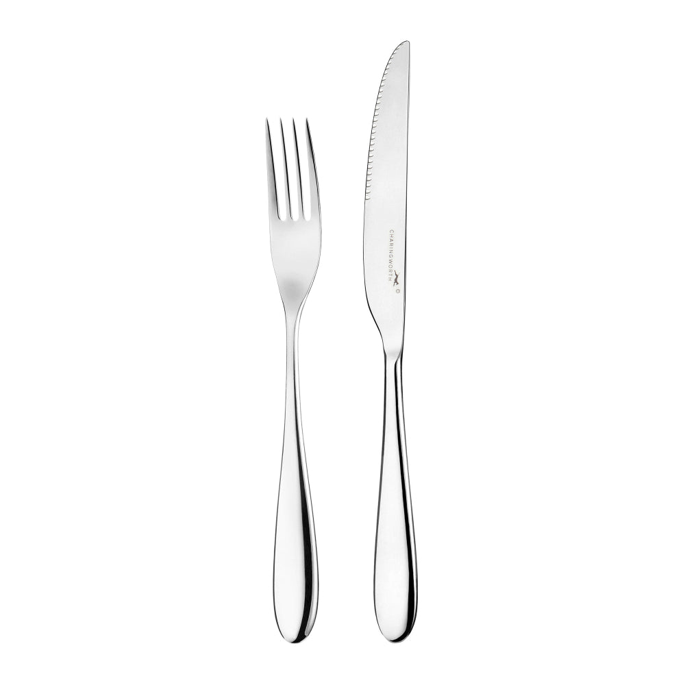 A steak knife and fork set with curved handles and a polished mirror finish, both made of 18-0 stainless steel.