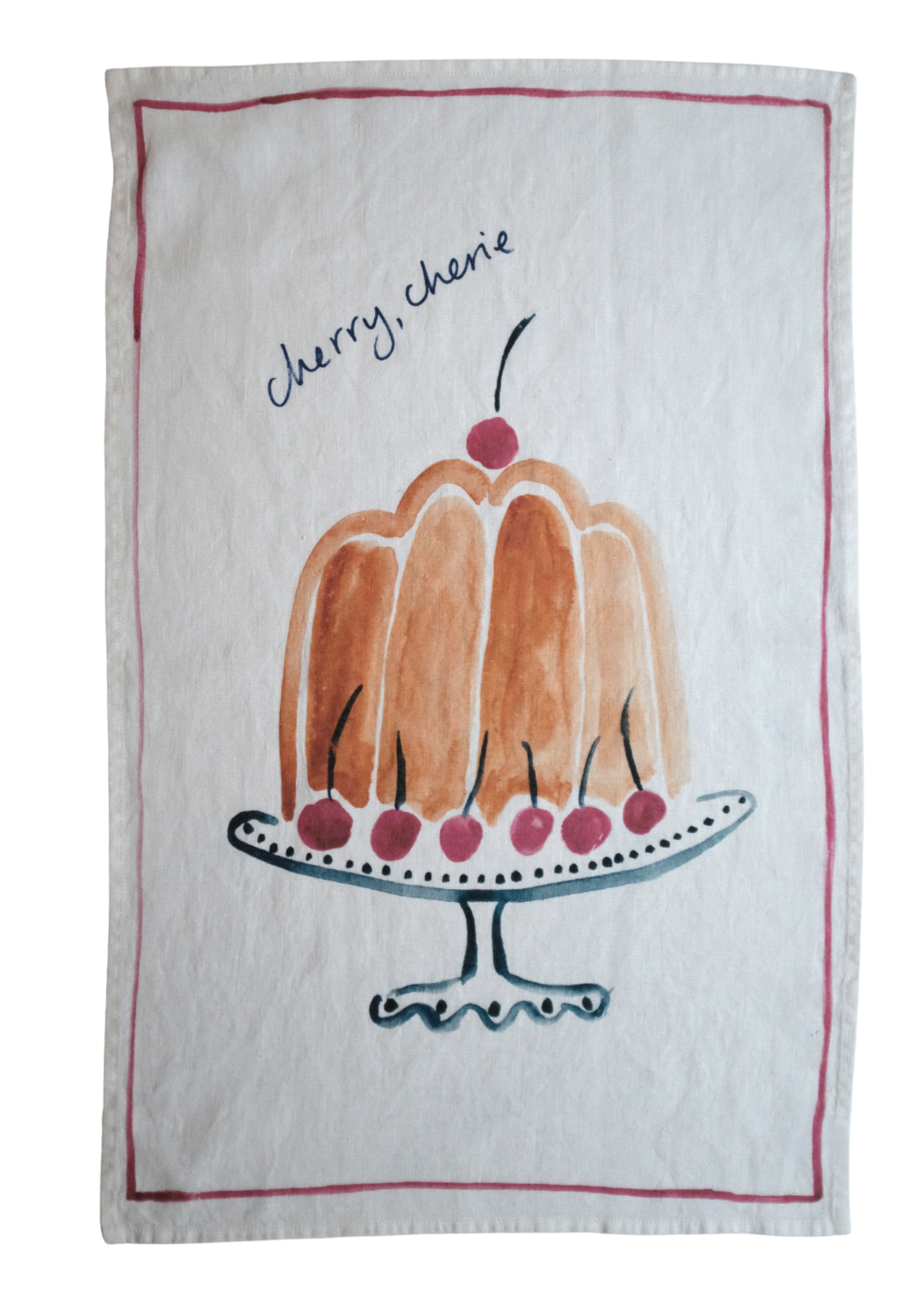 Tea towel with a bundt cake illustration and 'Cherry, cherie' text on a white background