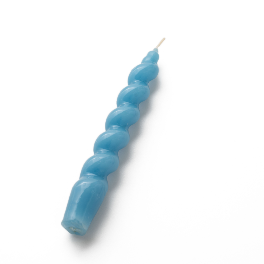 Blue spiral gloss taper candle on a white background