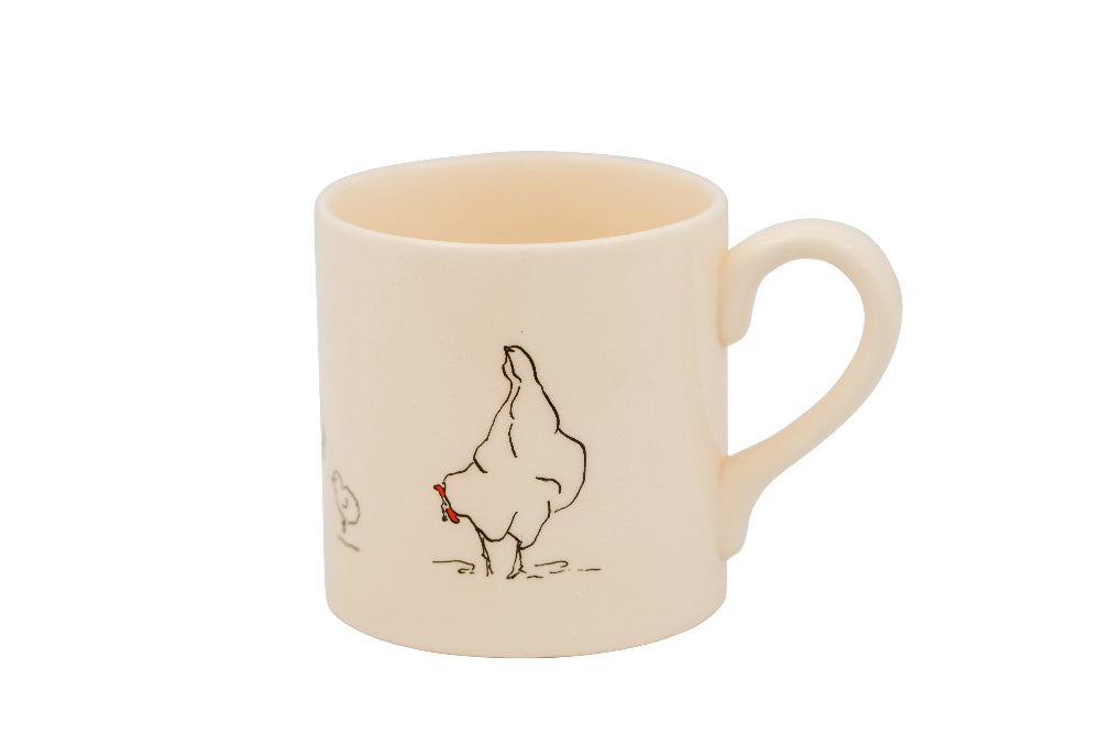 Beige mug with a chicken illustration on a white background