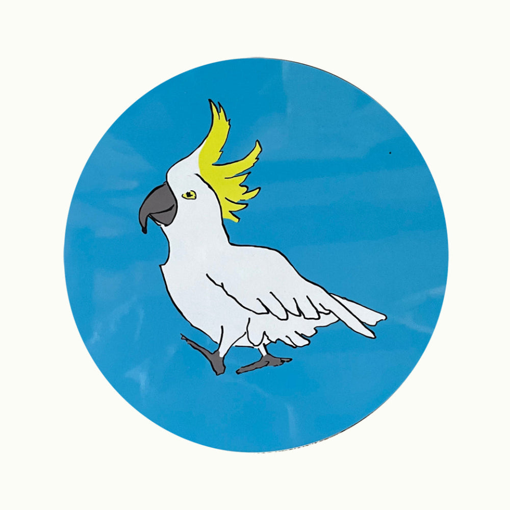 Illustration of a white Cockatoo with a yellow crest on a blue circular background