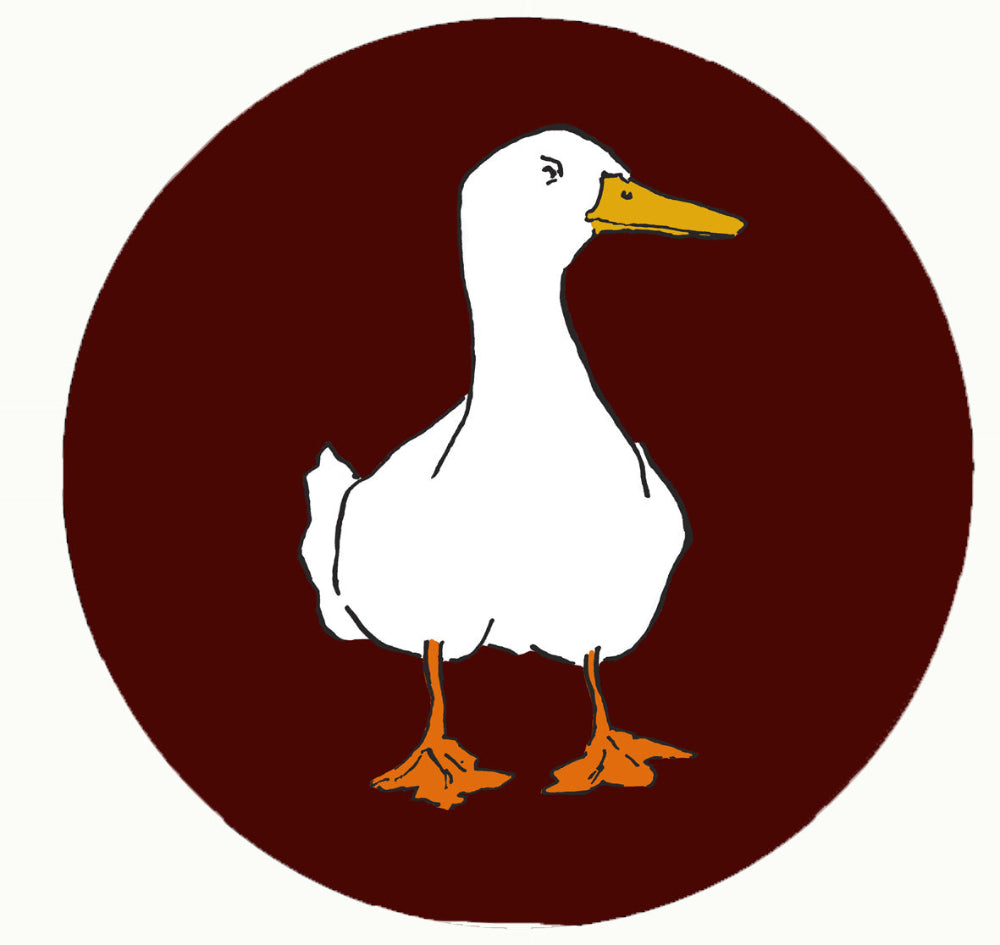 White duck with a yellow beak on a brown circle background
