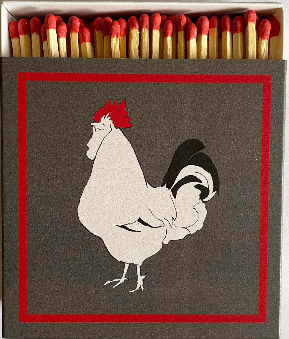 Matches with a rooster illustration on the box
